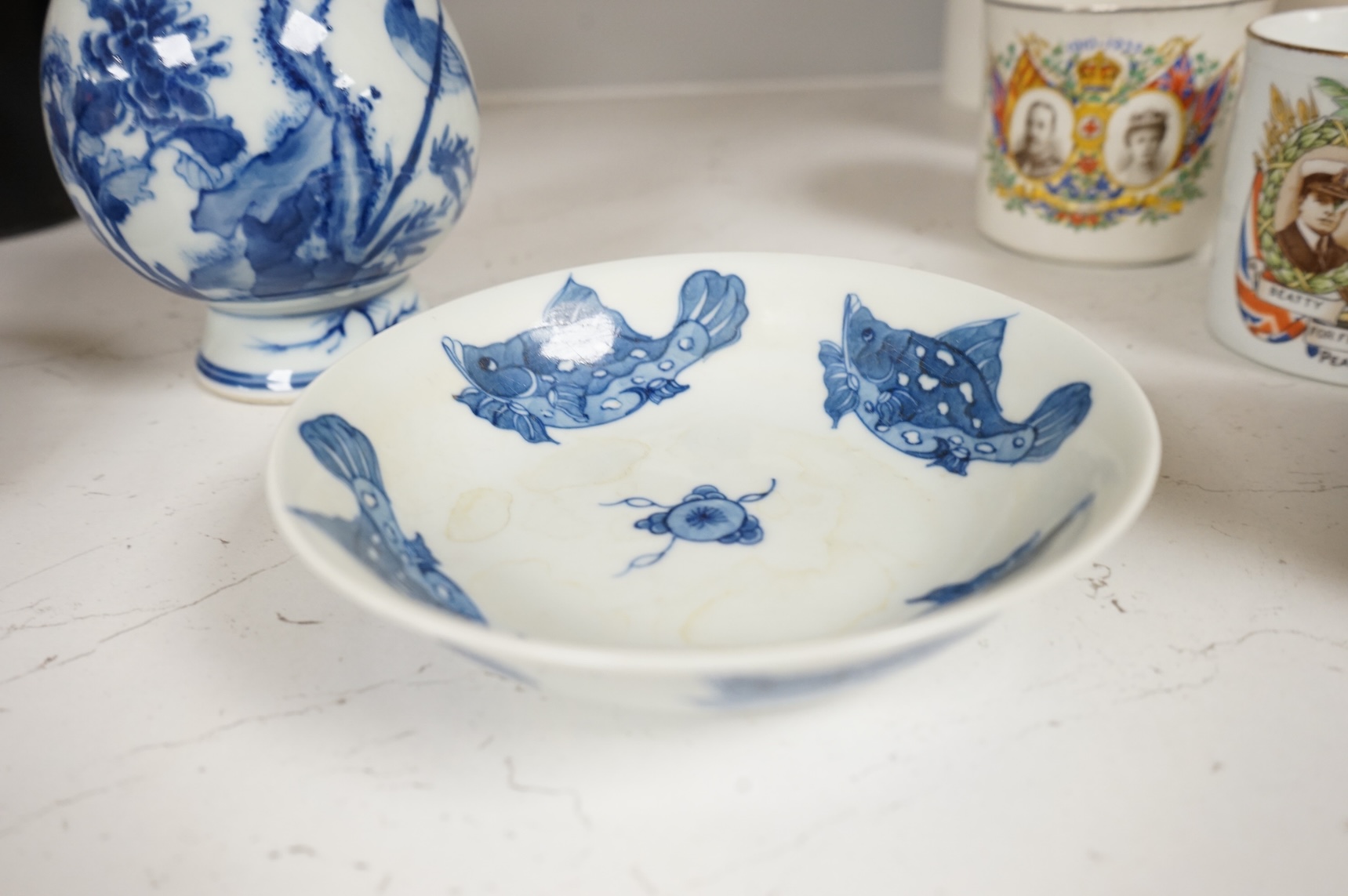 A Chinese blue and white vase and a ‘fish’ saucer dish, largest 19cm high
